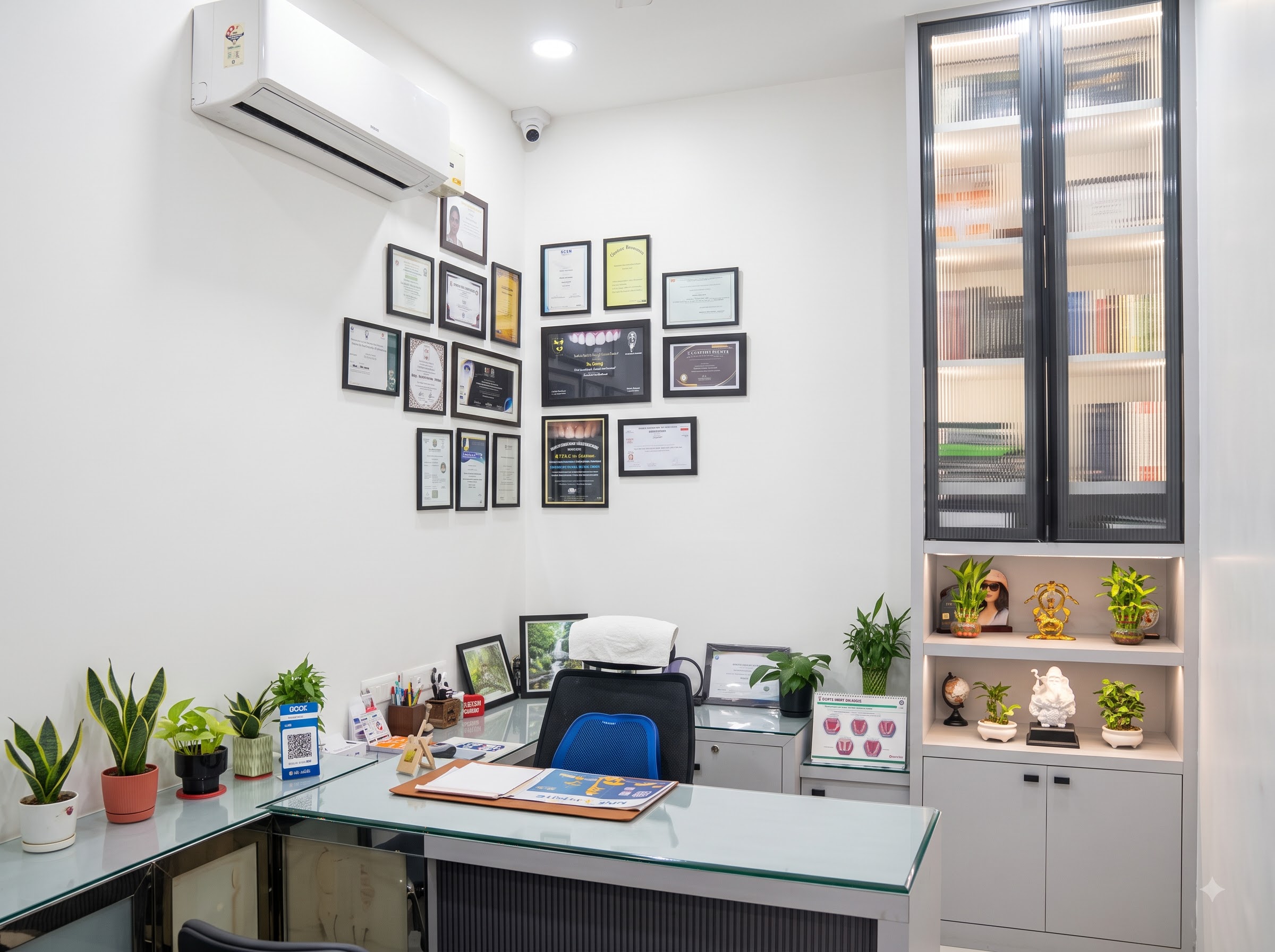 Dr. Preeti's consultation room with framed professional certificates